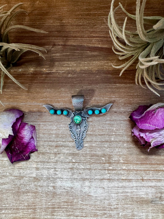 Sterling silver longhorn pendant with gold accent and 12mm bail, handmade and stamped by Native artist Leroy James