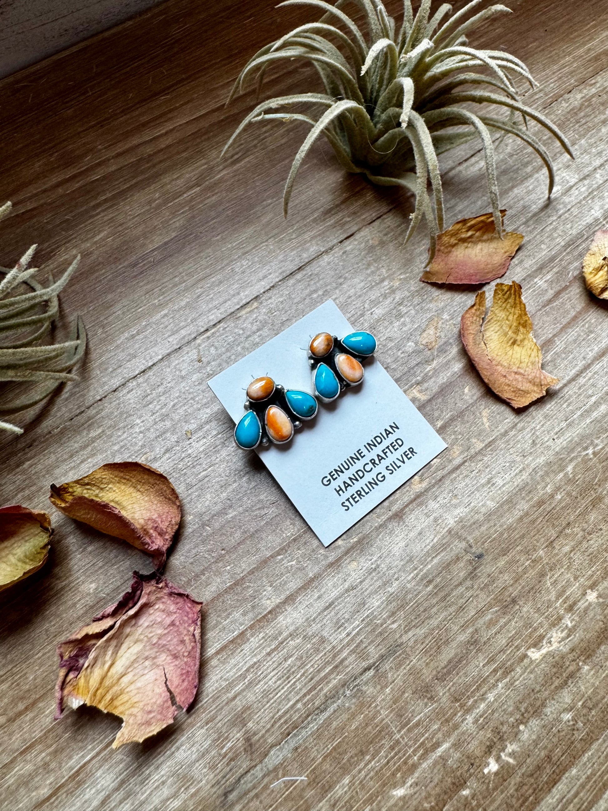 Handcrafted sterling silver stud earrings featuring orange spiny oyster and genuine turquoise stones. Stamped by Marcella James. Made in the USA. One-of-a-kind and naturally unique. Curated by The Bijoux FAB.