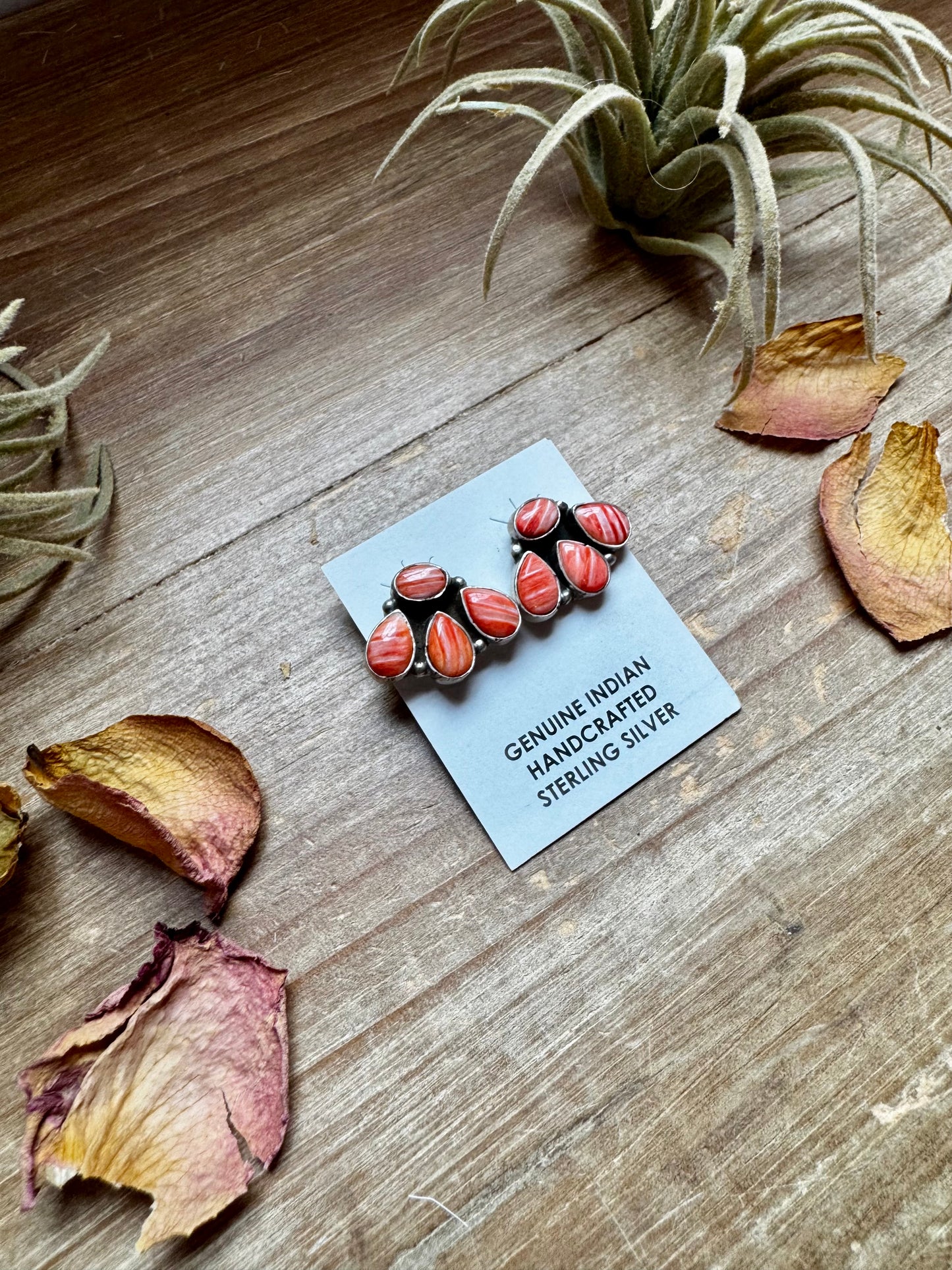 Handcrafted sterling silver stud earrings featuring vibrant spiny oyster shell, stamped by artist Marcella James. Made in the USA. One-of-a-kind design. Curated by The Bijoux FAB.