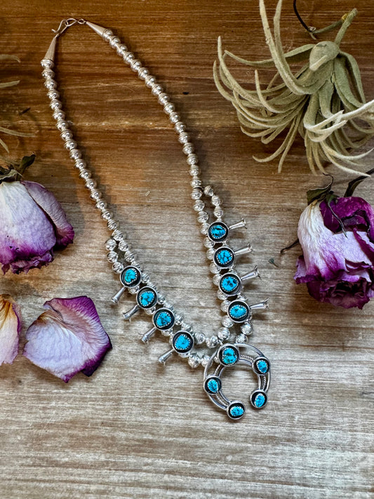 Sterling silver mini squash blossom necklace with Kingman turquoise and matching earrings, handmade by Navajo artist Lonora Garcia in the USA