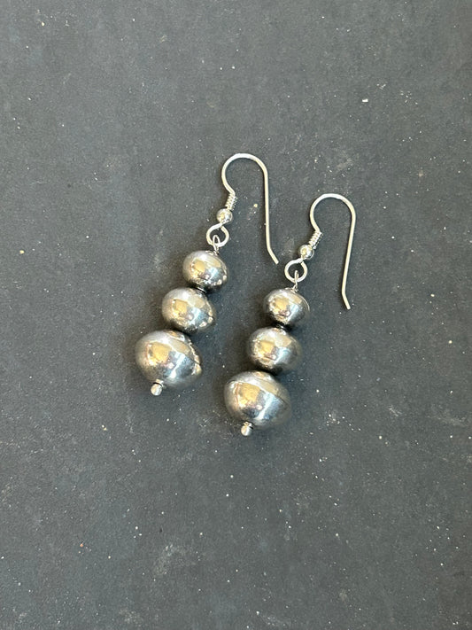 Sterling silver tapered Ponca pearl dangle earrings, handcrafted by artist Jason Ogg in the USA

