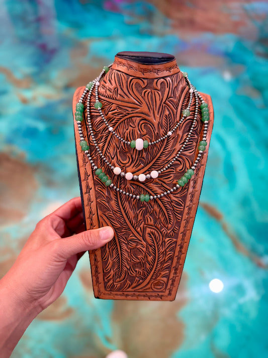 One-of-a-kind Jaci Collection necklace set featuring pink conch, green jade, and sterling silver pearls in a layered western-inspired design.