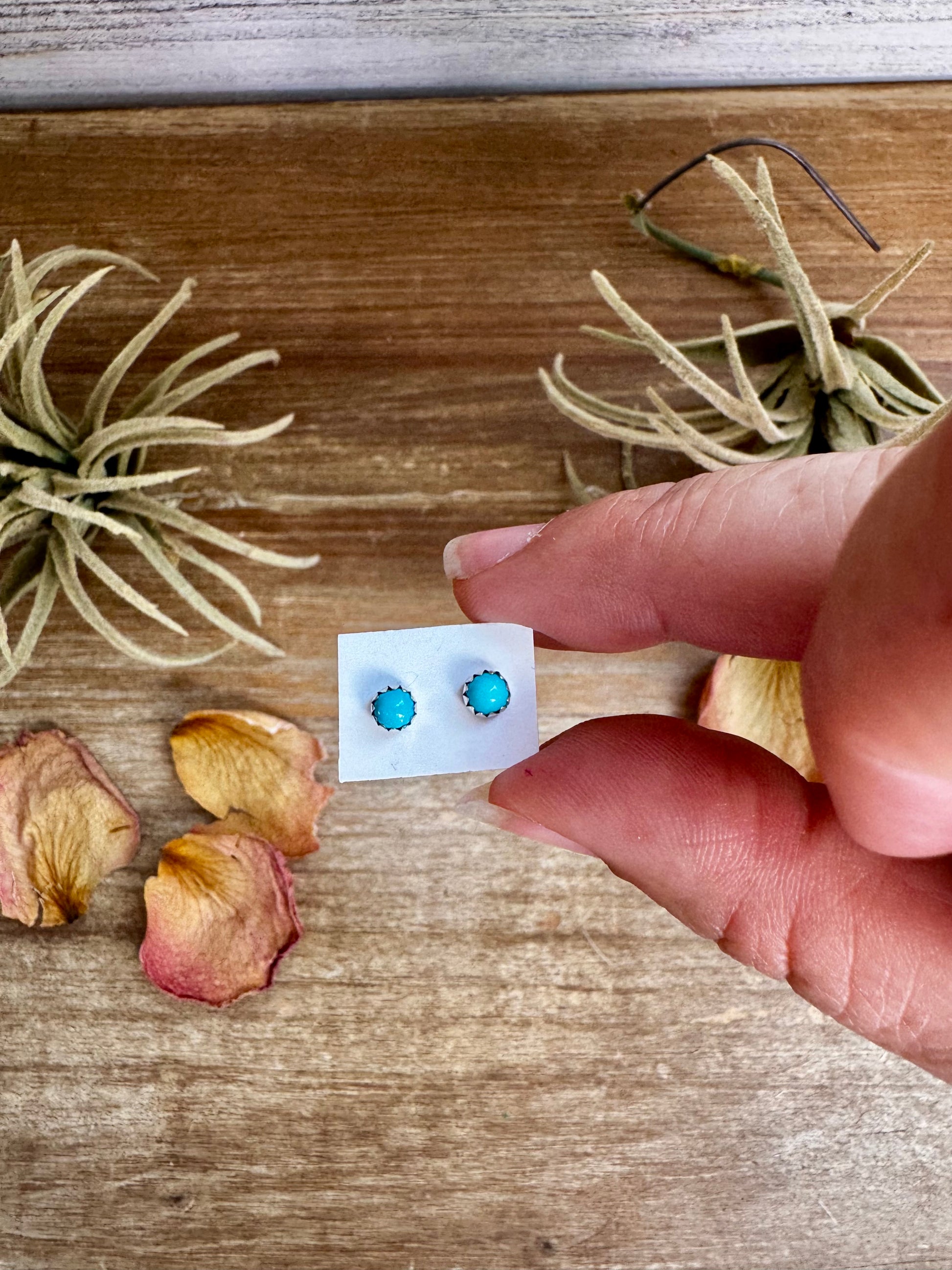Mini turquoise stud earrings in sterling silver, handmade by Navajo artist Linda Yazzie
