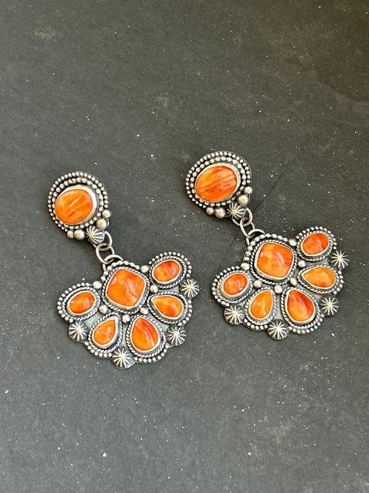Sterling silver half-cluster dangle earrings with orange spiny oyster stones, handcrafted by artist Shay Pfeiffer in the USA