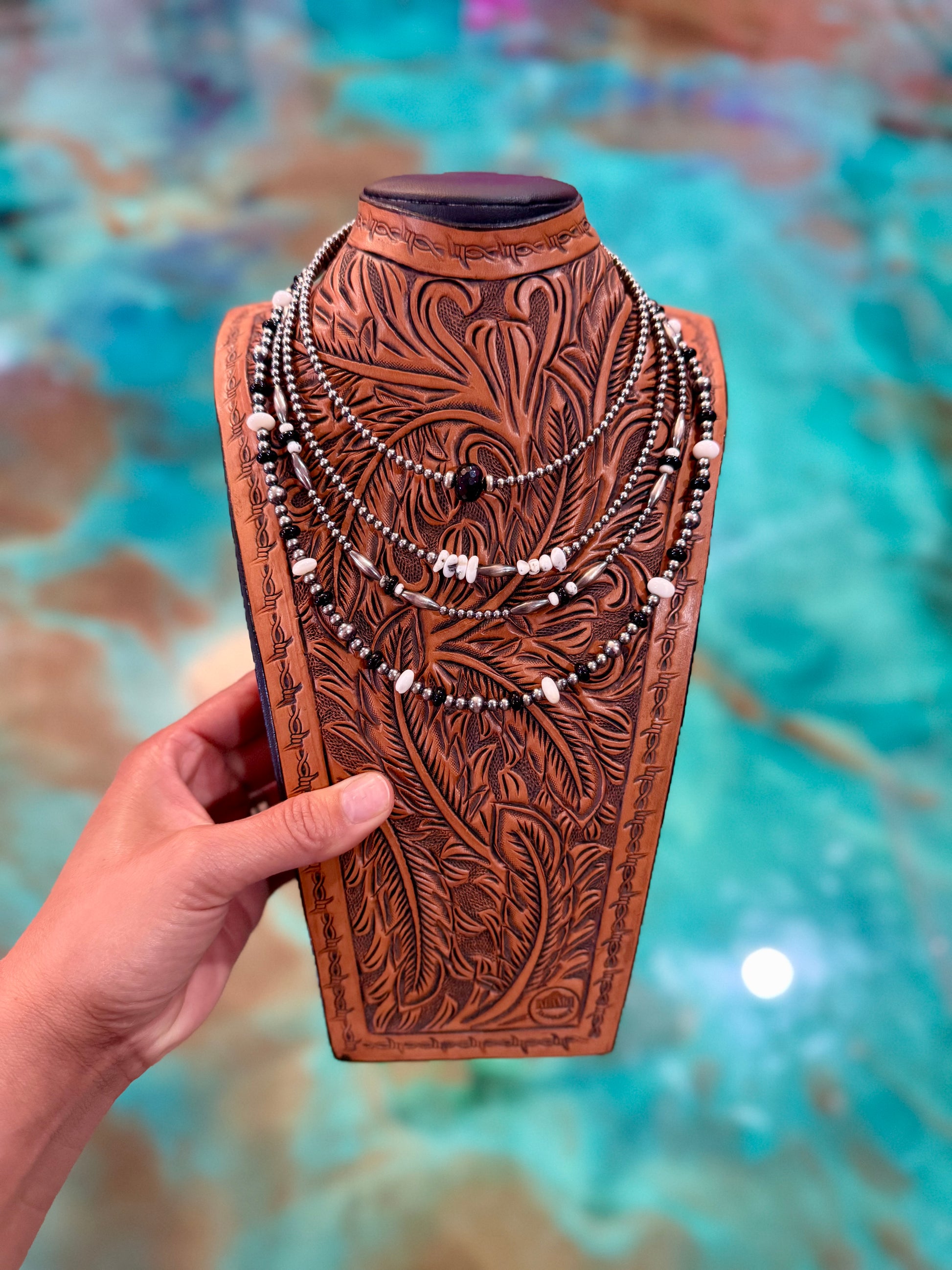 One-of-a-kind Jaci Collection jewelry set featuring sterling silver pearls, black onyx, white buffalo, white shell, and sterling silver torpedo accents in a layered western design.