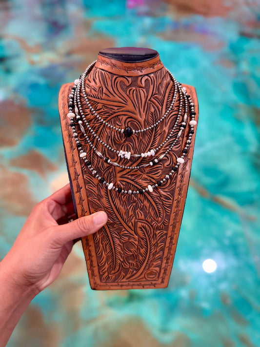 One-of-a-kind Jaci Collection jewelry set featuring sterling silver pearls, black onyx, white buffalo, white shell, and sterling silver torpedo accents in a layered western design.