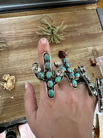 Blue cactus with flower with turquoise rings