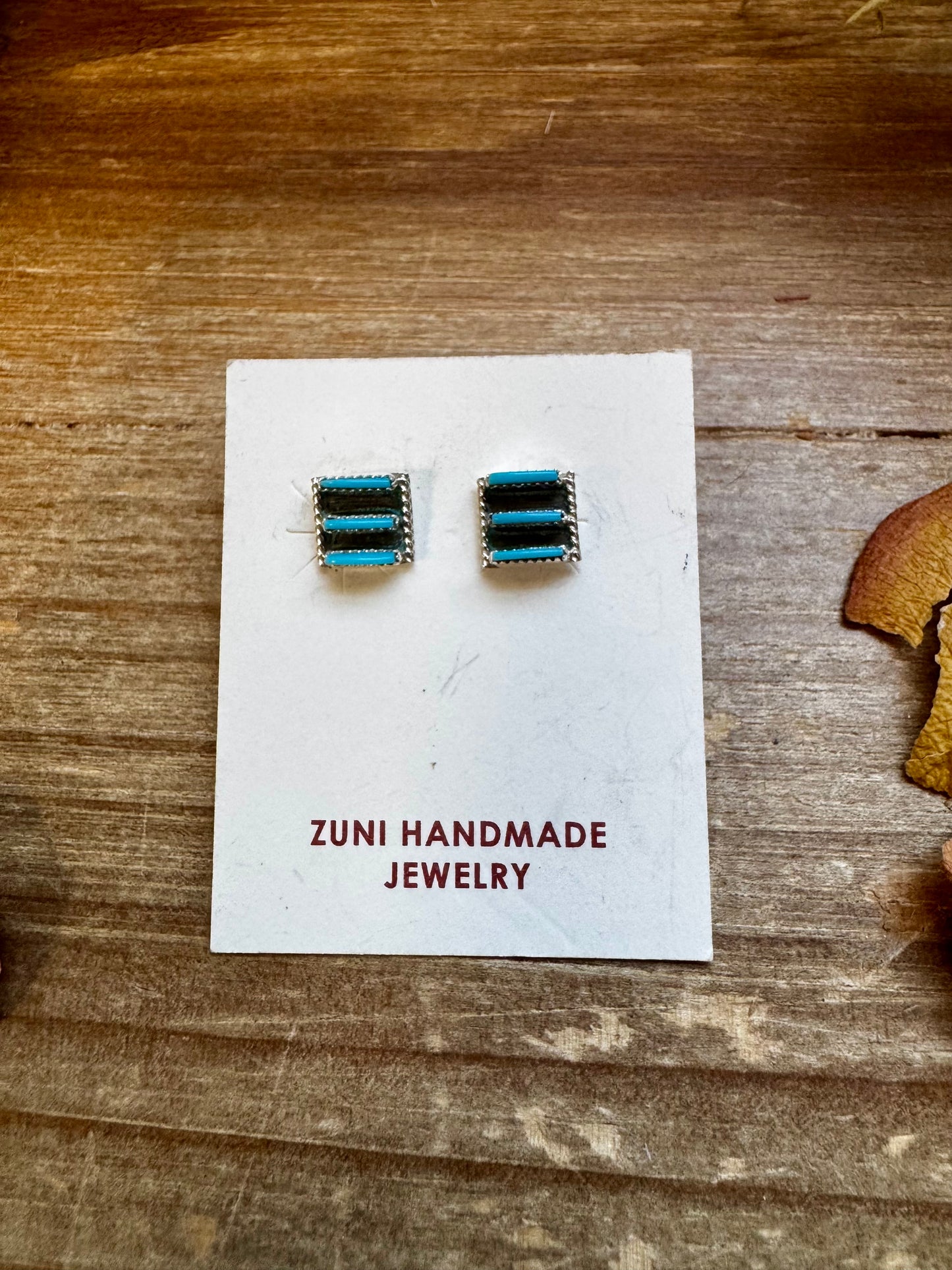 Zuni-made square Kingman turquoise stud earrings in sterling silver by artist Davis Kaamasee