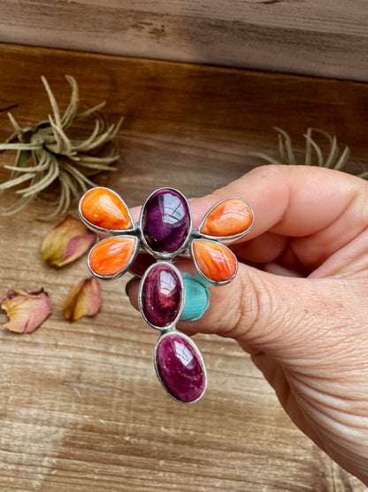 Handcrafted sterling silver dragonfly ring featuring purple and orange spiny oyster stones. Stamped ZIA and made in the USA. Adjustable fit and full of playful personality. Curated by The Bijoux FAB.