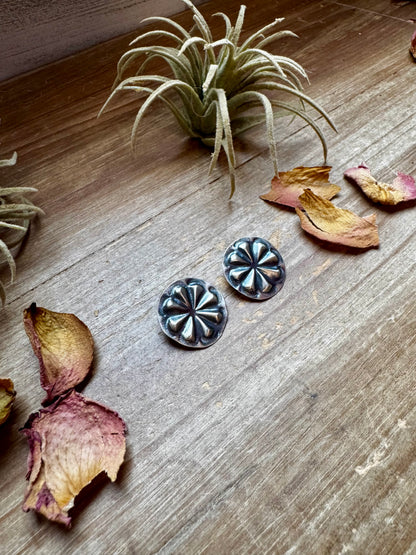 Handcrafted sterling silver concho stud earrings with traditional western stamping and stud backing. Stamped STERLING and made in the USA. Lightweight and easy to wear. Curated by The Bijoux FAB.