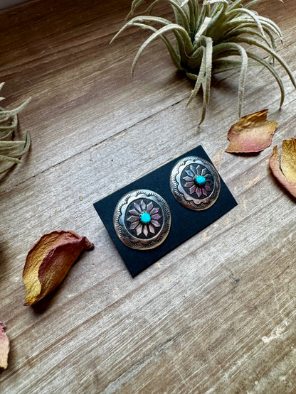 Handcrafted sterling silver concho earrings featuring genuine Kingman turquoise and unique hand-stamped details. Stamped STERLING and made in the USA. Each pair is slightly different. Curated by The Bijoux FAB.