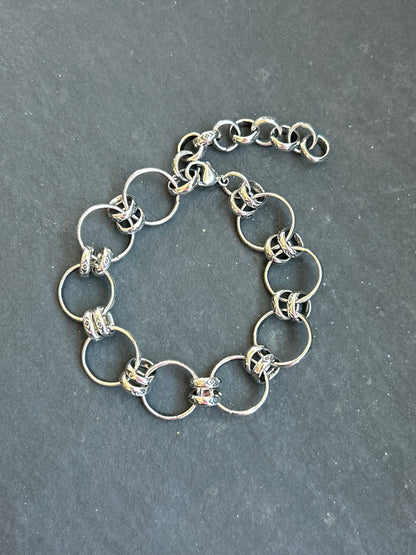 Sterling silver Medicine Man Eye pattern charm chain bracelet with 2-inch extender, handcrafted by artist Jason Ogg in the USA