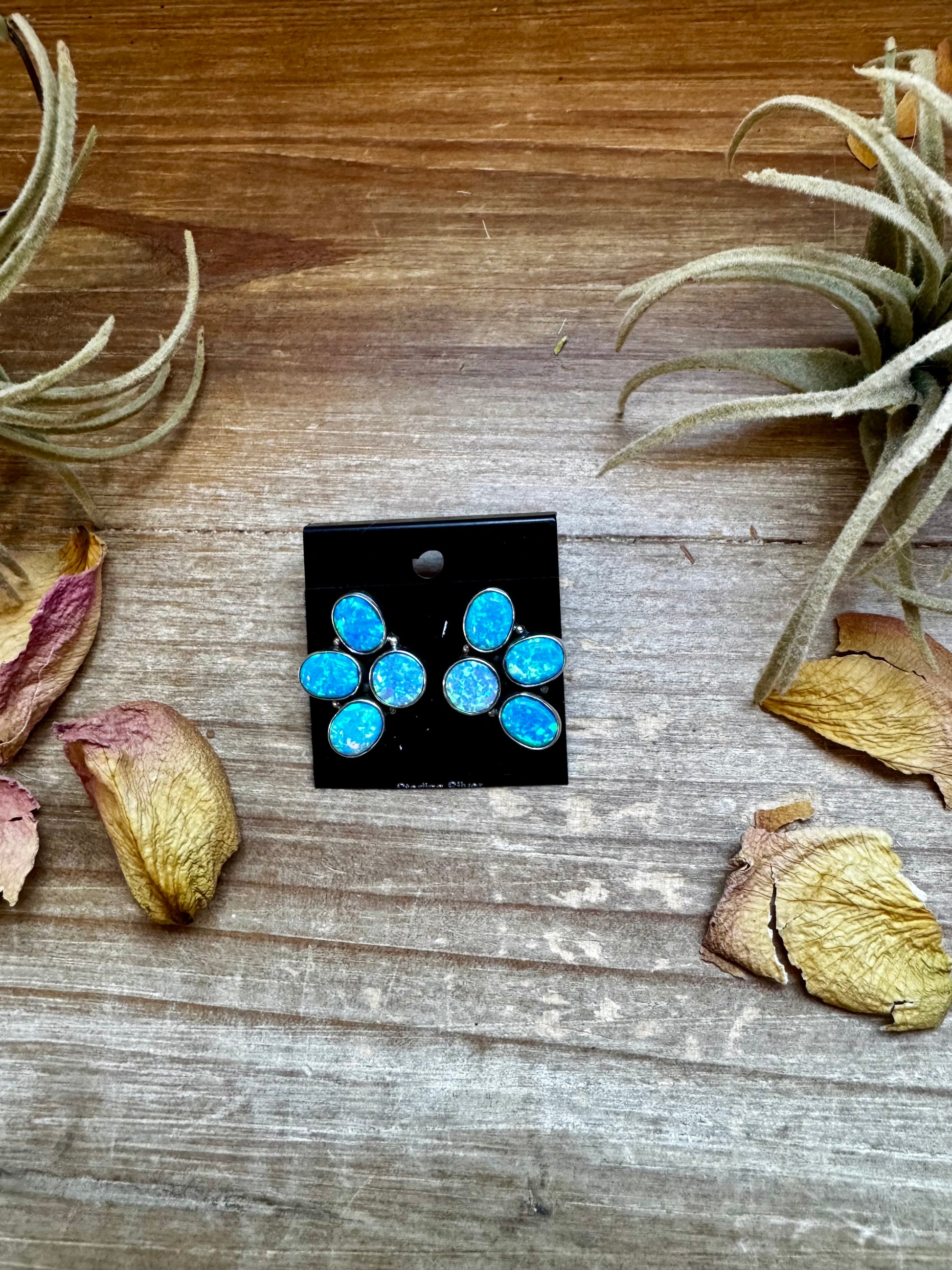 One-of-a-kind sterling silver half-cluster stud earrings with blue opal stones, handmade in the USA