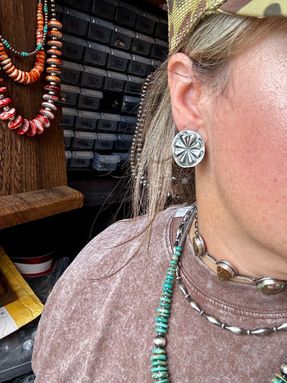 Handcrafted sterling silver concho stud earrings with traditional western stamping and stud backing. Stamped STERLING and made in the USA. Lightweight and easy to wear. Curated by The Bijoux FAB.