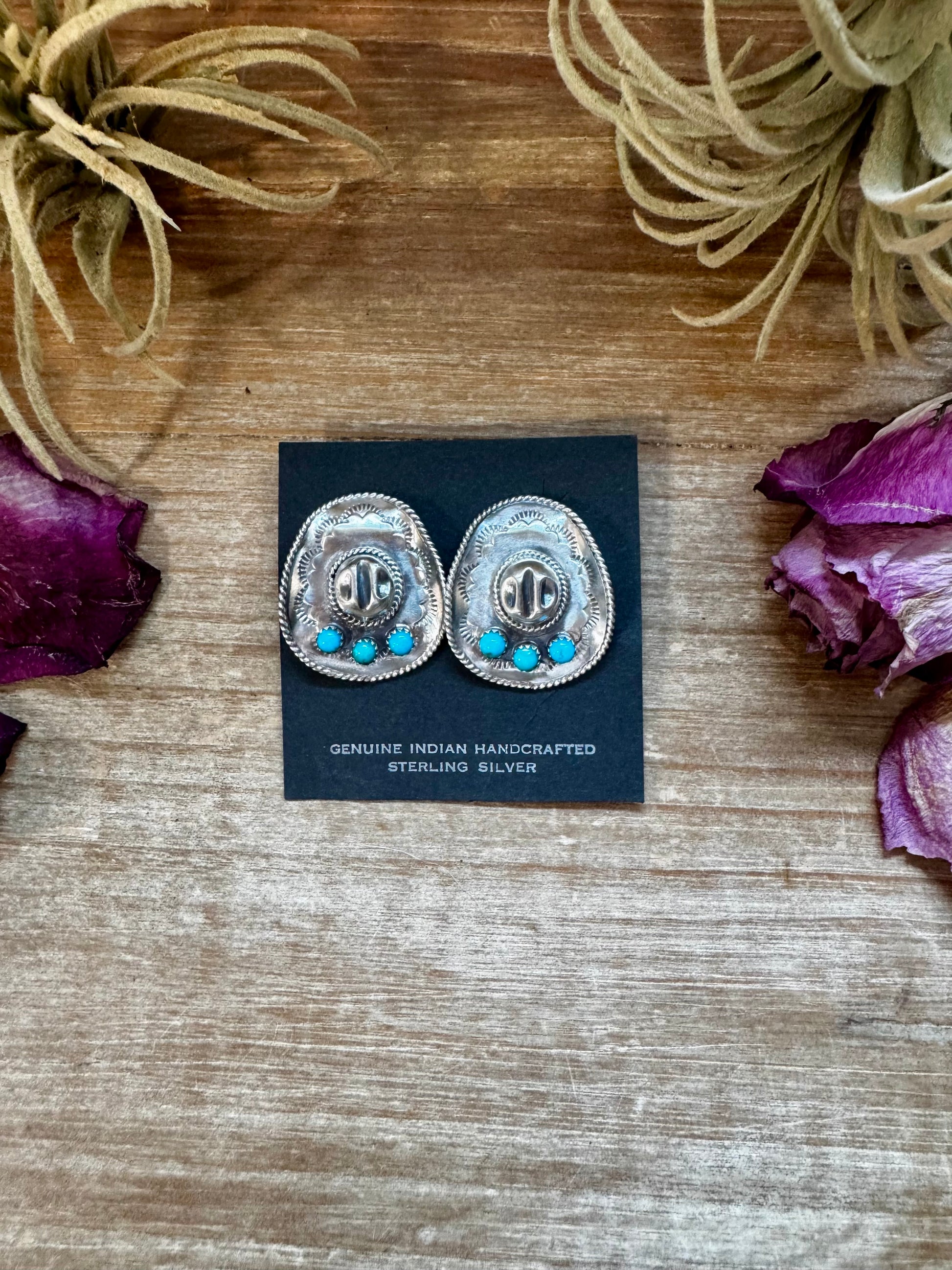 Sterling silver cowboy hat stud earrings with Kingman turquoise, handmade by Navajo silversmith Bobby Platero in the USA