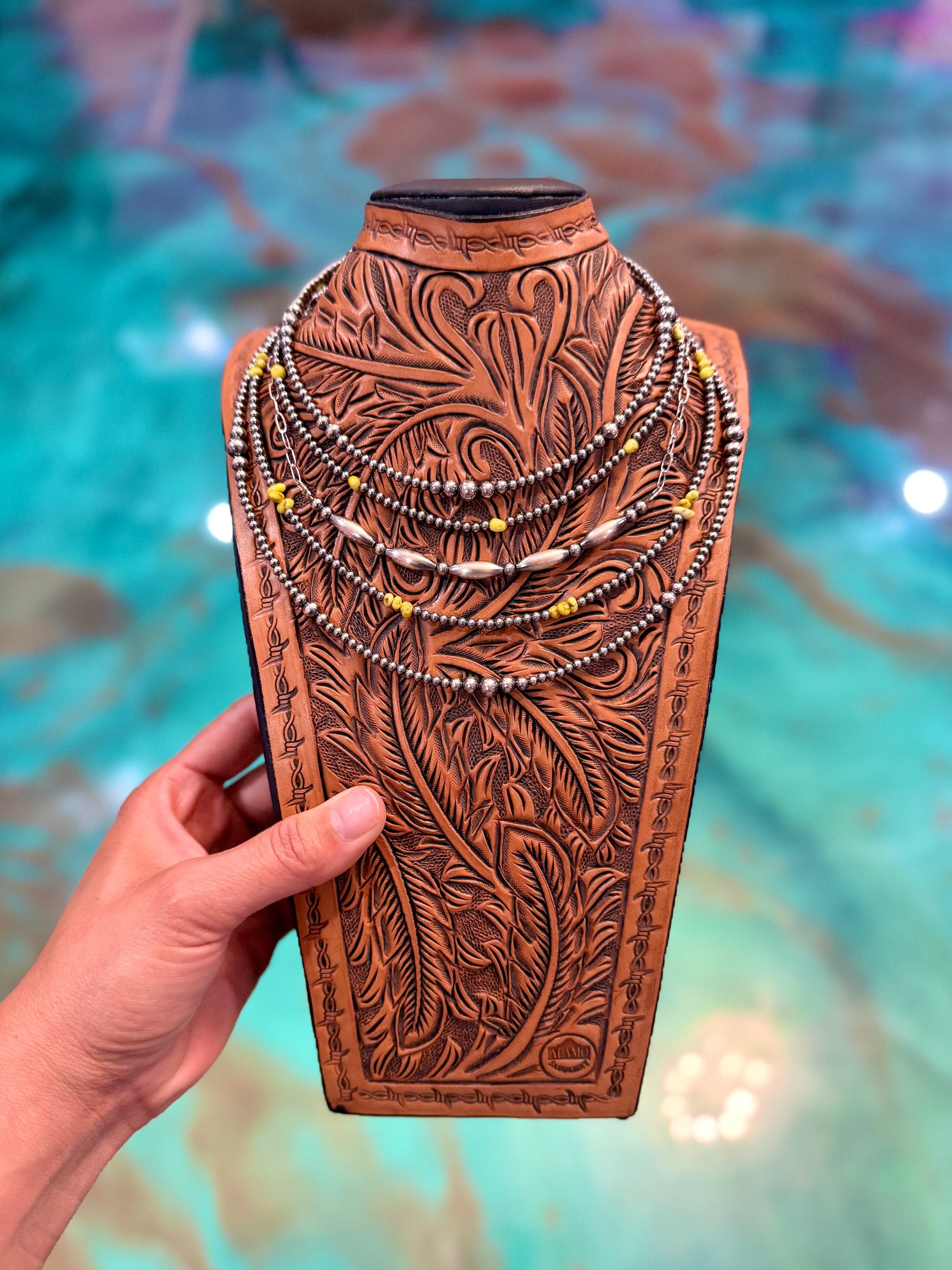 Five-piece Palomino Turquoise and sterling silver necklace stack featuring graduated sterling silver pearl necklaces, turquoise bead necklaces, and a paperclip chain with sterling silver torpedo accents handcrafted by The Bijoux FAB.