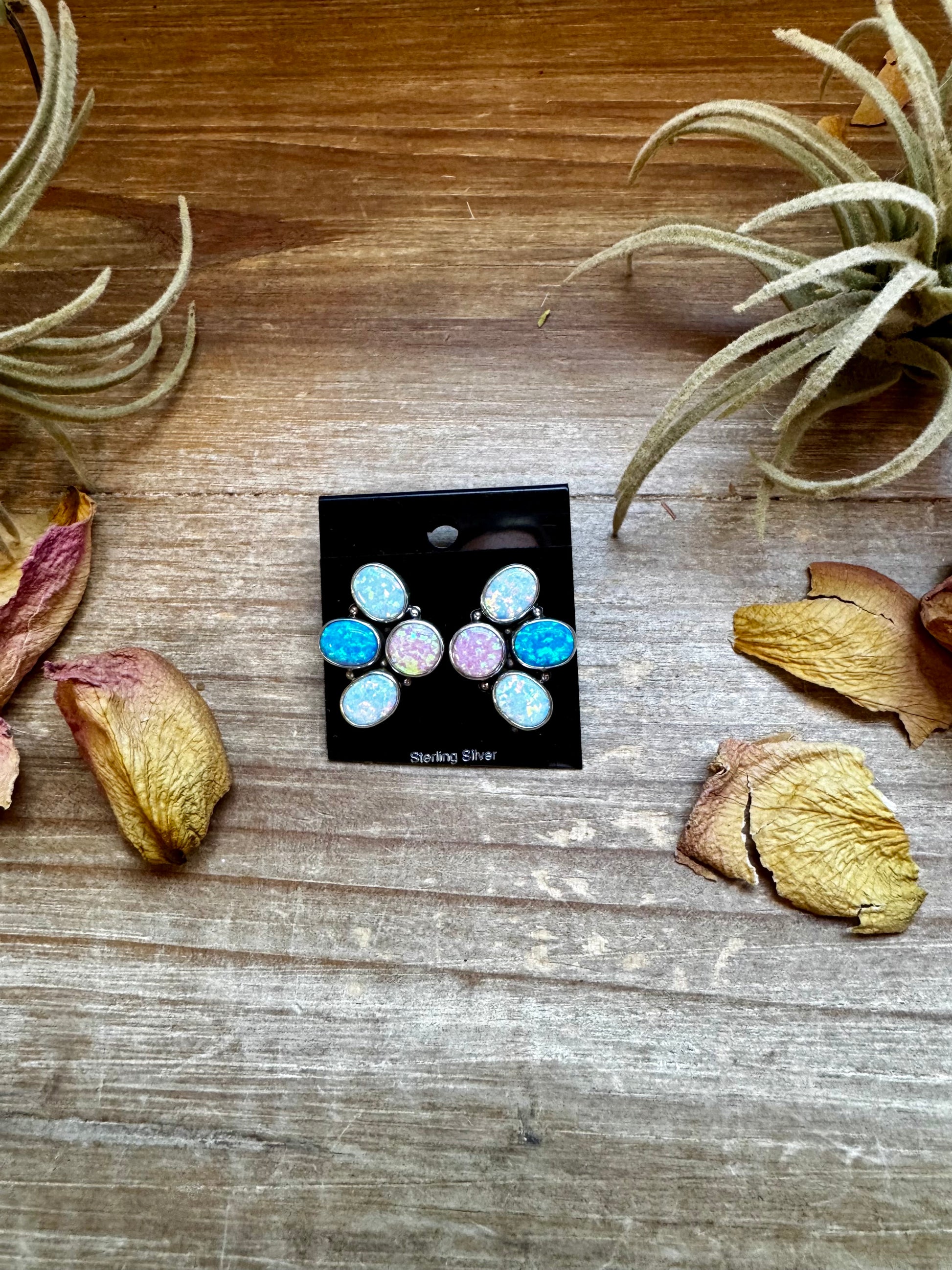 Sterling silver half-cluster stud earrings with pink, blue, and white opal stones, handmade in the USA