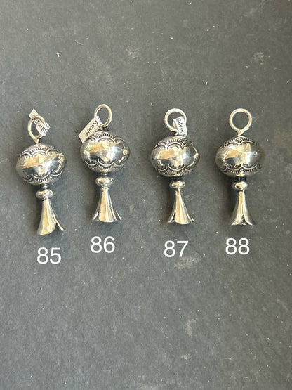 Sterling silver hand-milled mini blossom pendant with sun ray stamp design by artist Jason Ogg, made in the USA