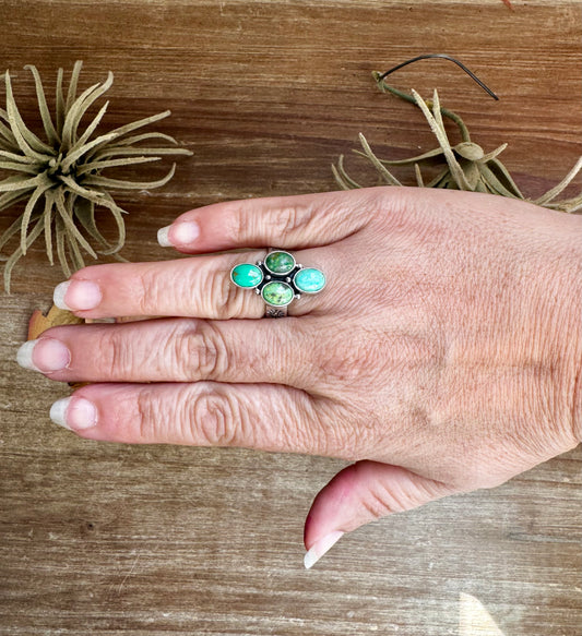 Adjustable ring with four green turquoise stones set in sterling silver, stamped ZIA, USA made