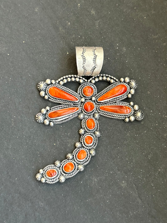 Sterling silver dragonfly pendant with orange spiny oyster stone, handcrafted by artist Shay Pfeiffer in the USA