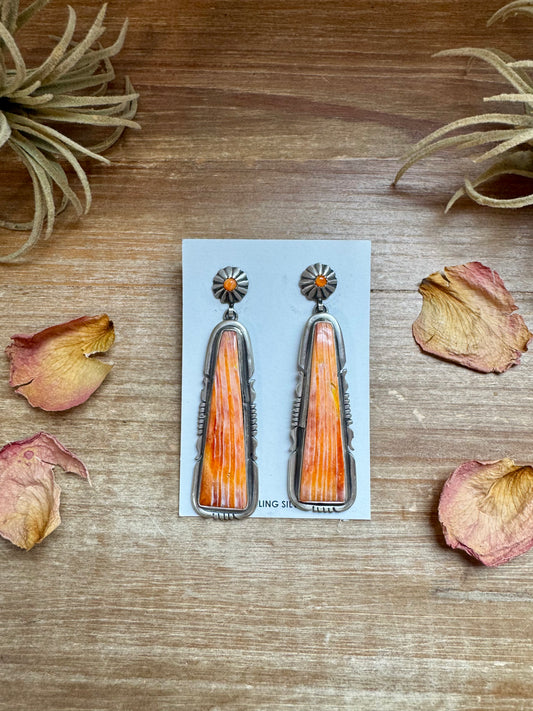 Long orange spiny oyster dangle earrings on post, sterling silver, handmade by Native artist Jon McCray