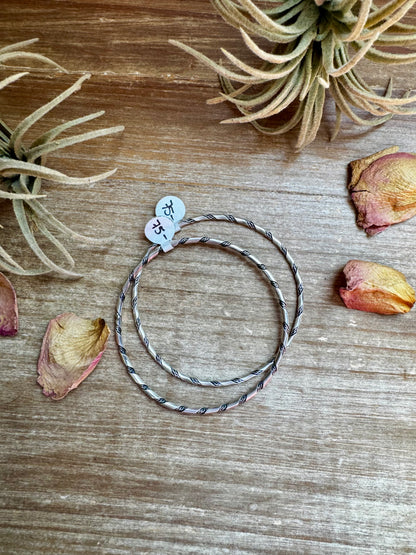 Native-made sterling silver bangle bracelets, each unique in pattern and finish, sold separately