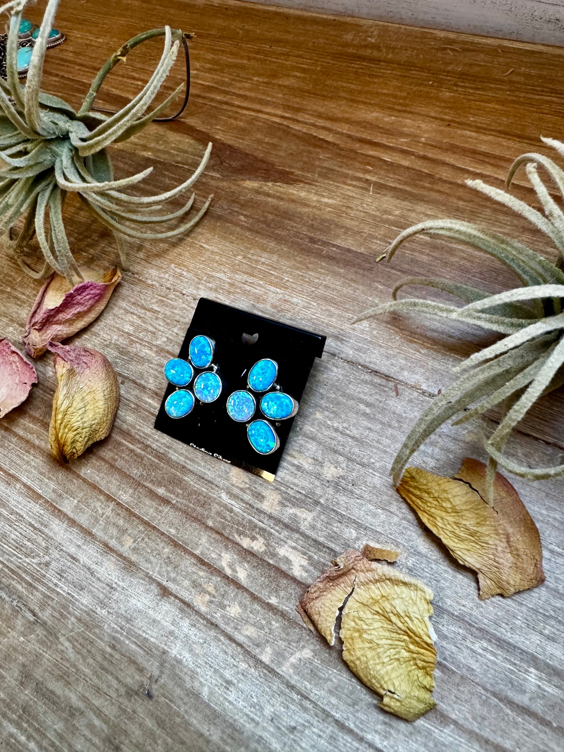 One-of-a-kind sterling silver half-cluster stud earrings with blue opal stones, handmade in the USA