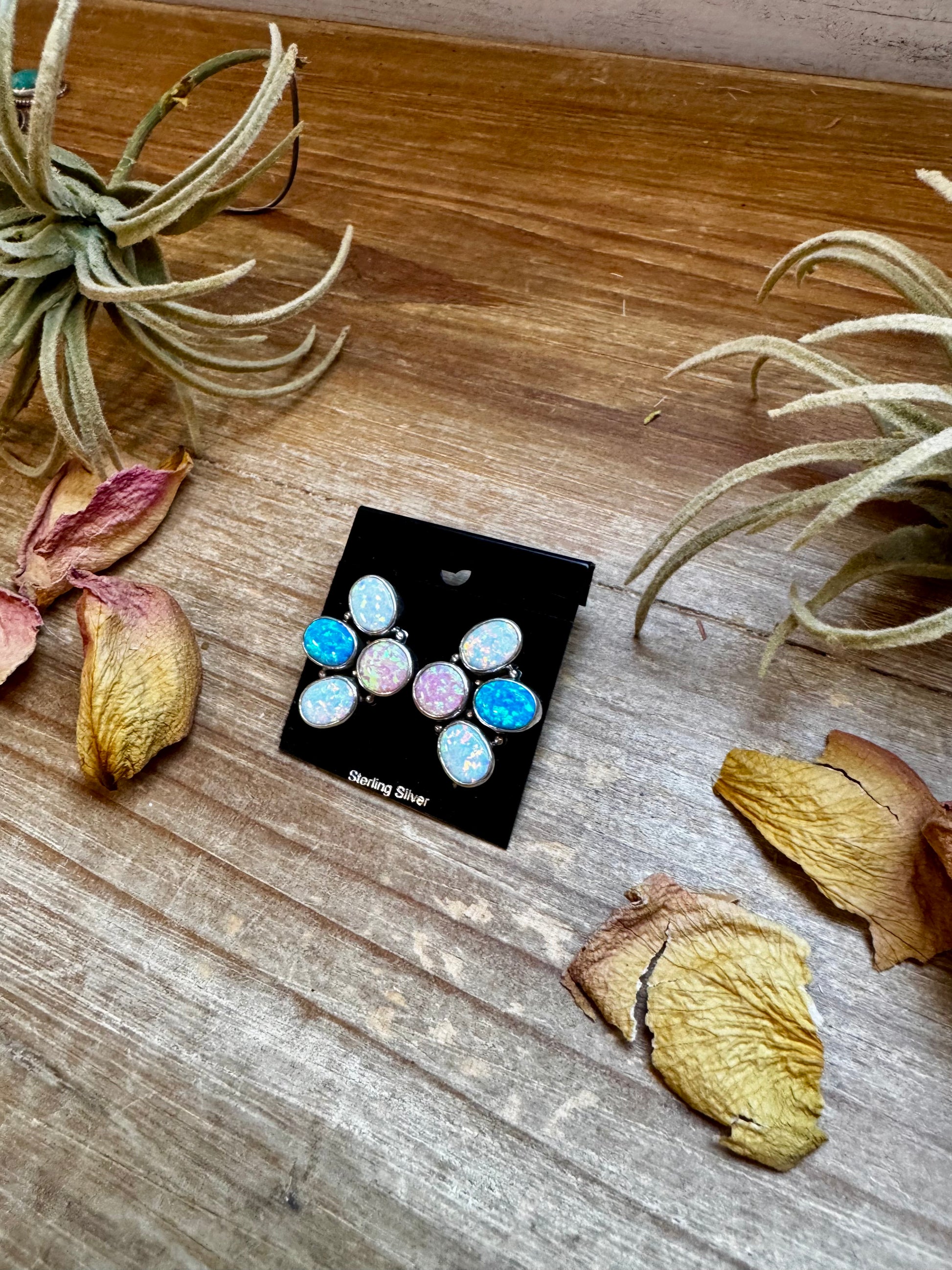 Sterling silver half-cluster stud earrings with pink, blue, and white opal stones, handmade in the USA