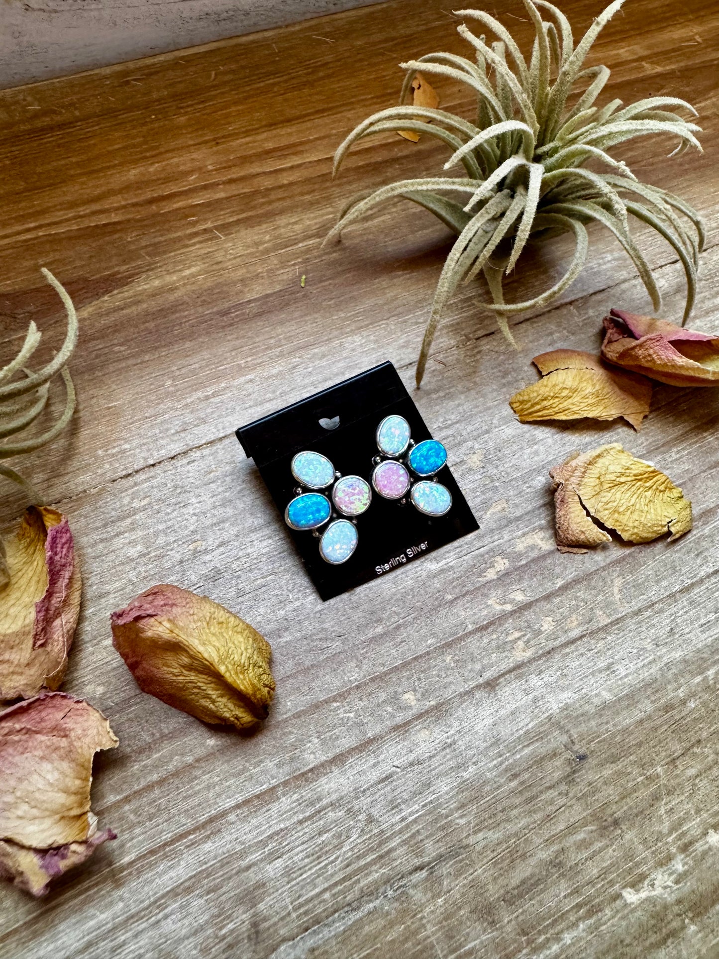 Sterling silver half-cluster stud earrings with pink, blue, and white opal stones, handmade in the USA