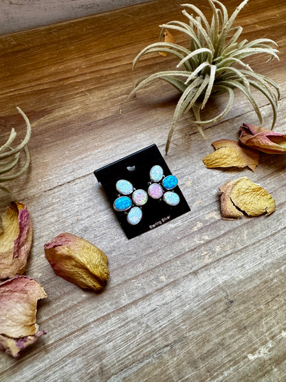 Sterling silver half-cluster stud earrings with pink, blue, and white opal stones, handmade in the USA