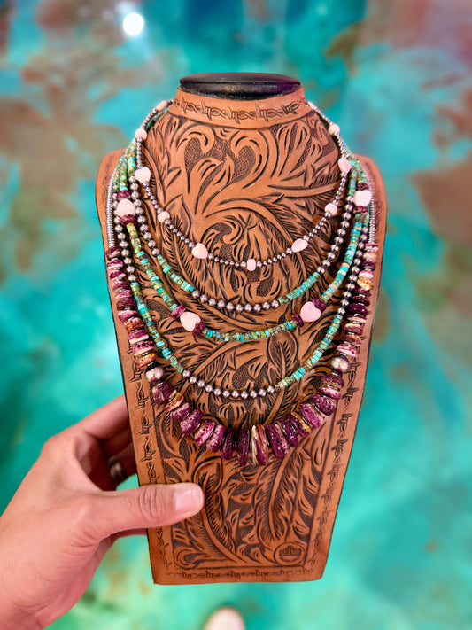 Five piece summer necklace stack featuring turquoise heishi, pink conch, purple spiny oyster, hematite, and sterling silver pearls handmade by The Bijoux FAB