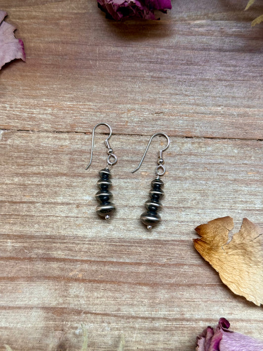 Sterling silver saucer pearl dangle earrings handmade by Colby Ogg and Addalie Ogg, 5–9 mm saucer pearls, USA made