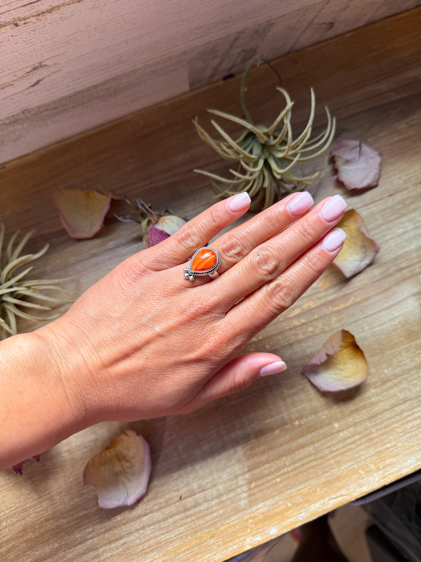 Sterling silver ring with orange spiny oyster stone, available in sizes 7 and 10, made in the USA