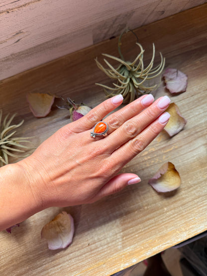 Sterling silver ring with orange spiny oyster stone, available in sizes 7 and 10, made in the USA