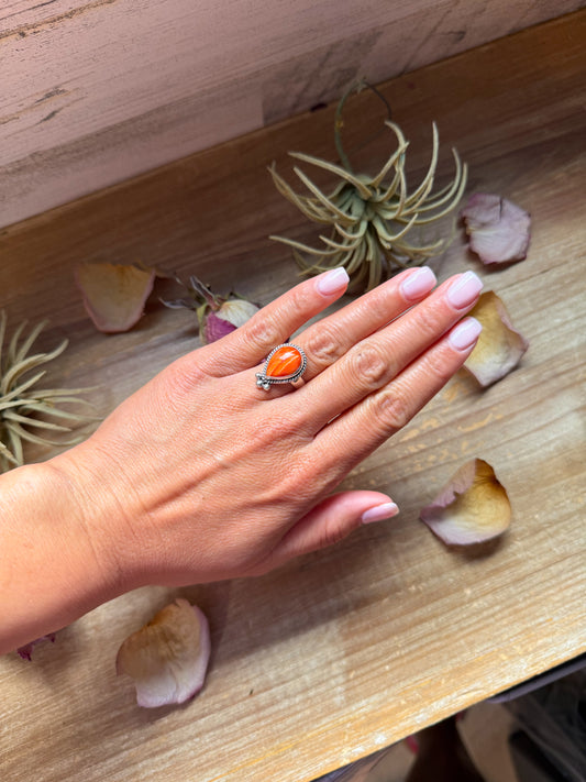 Sterling silver ring with orange spiny oyster stone, available in sizes 7 and 10, made in the USA
