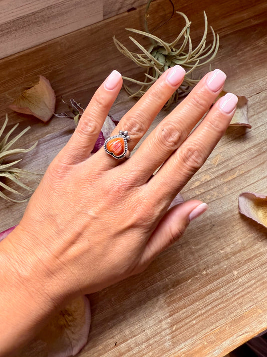 Size 7 sterling silver ring with heart-shaped orange spiny oyster stone, stamped Sterling, made in the USA