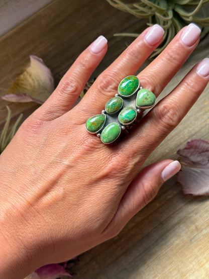 Size 8.5 sterling silver ring with six green turquoise stones, stamped Sterling, made in the USA