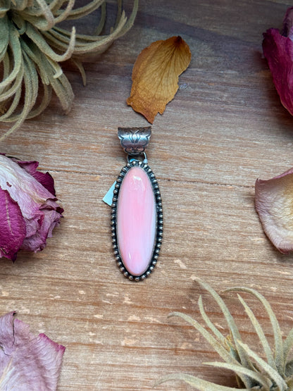 Long oval sterling-silver pendant with pink conch shell, 2.75 inches long by 1 inch wide, stamped NED NEZ and Sterling, 8 mm bail, handmade in the USA