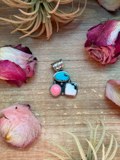 Sterling-silver pendant with Kingman turquoise, pink conch, and White Buffalo stones, 1.5 inches long by 1.25 inches wide, 6 mm bail, handmade in New Mexico USA