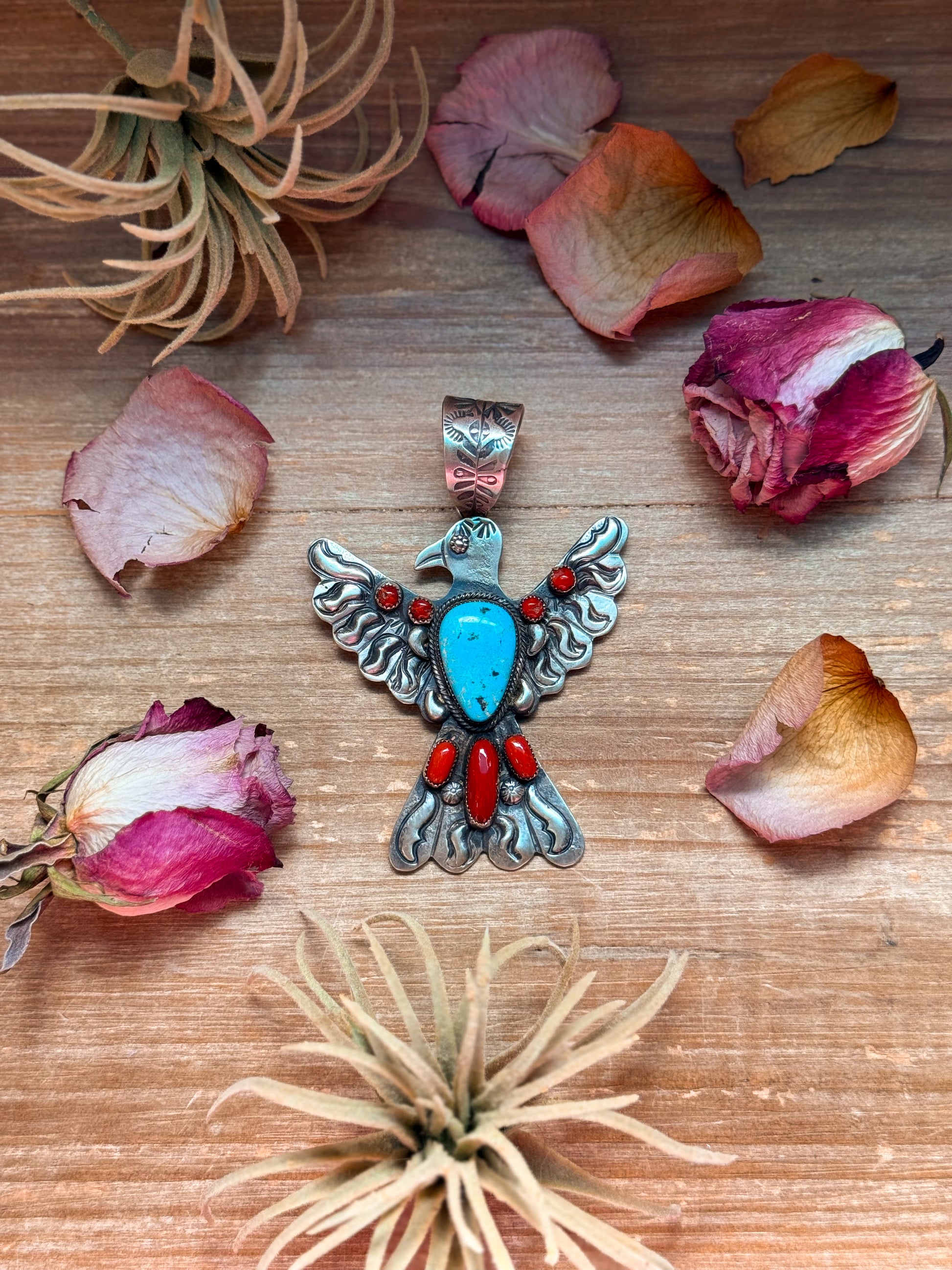 Large sterling-silver Thunderbird pendant with red coral and turquoise stones, stamped Richard Yazzie and Sterling, 4 inches long by 3 inches wide, 16 mm bail, Native made in USA