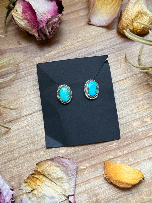 Sterling silver Sonoran Mountain Turquoise stud earrings, handmade by artist Jason Ogg, stamped Sterling, made in USA