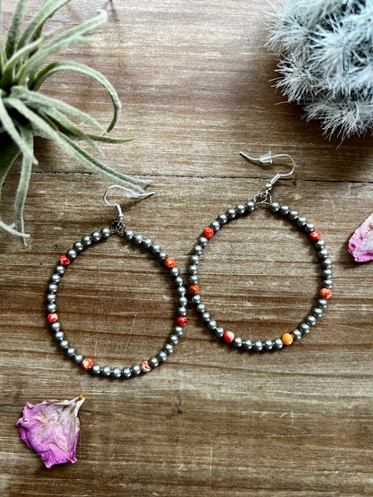 Large orange magnesite hoop earrings with silver plated beads handmade by The Bijoux FAB
