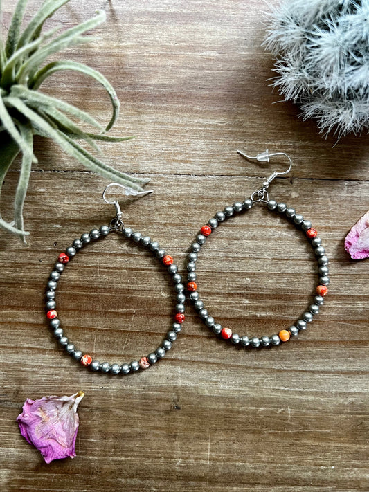 Large orange magnesite hoop earrings with silver plated beads handmade by The Bijoux FAB

