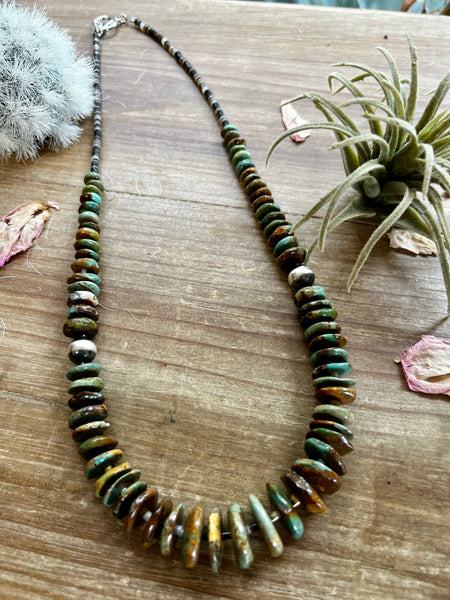 22 inch graduated turquoise necklace with Navajo pearl