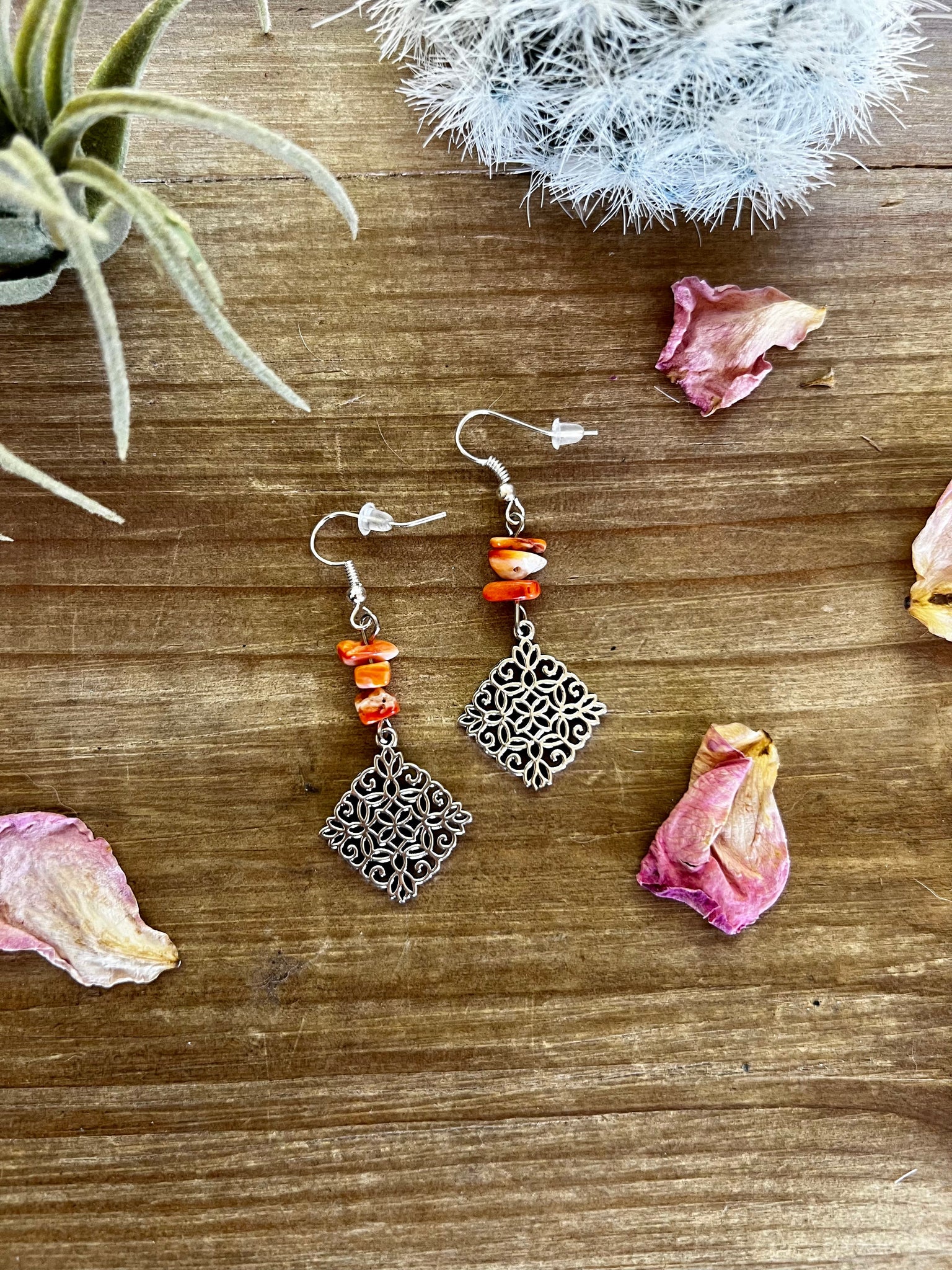 Orange spiny dangle earrings