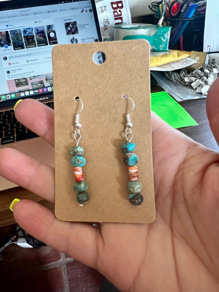 Red and blue earrings dangle real turquoise